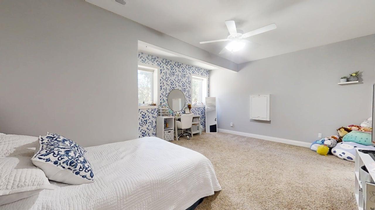 2112 Slade Lane Mahomet, IL 61853 - Photo 52 of 68 a bedroom with a bed and a large window