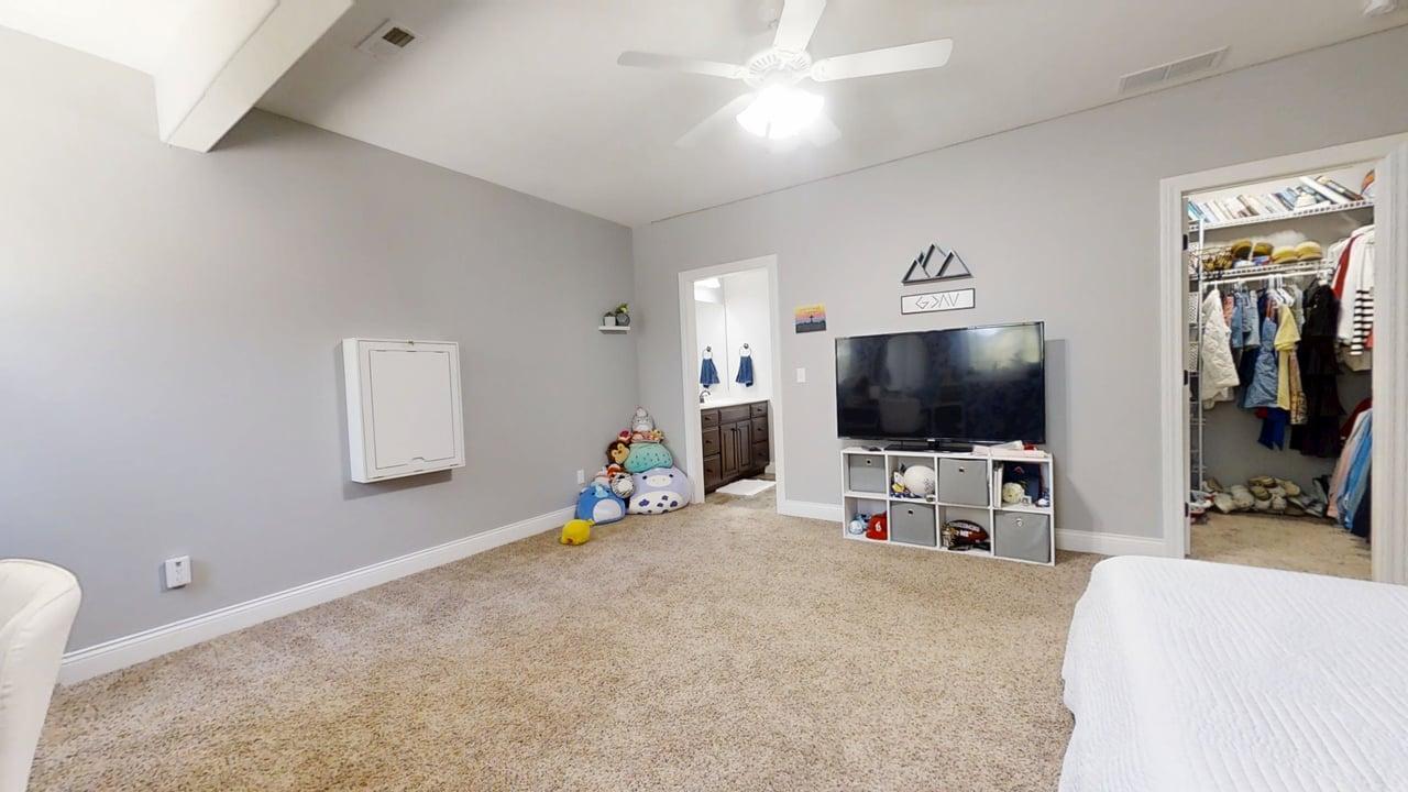 2112 Slade Lane Mahomet, IL 61853 - Photo 55 of 68 a view of a livingroom with furniture and a flat screen tv