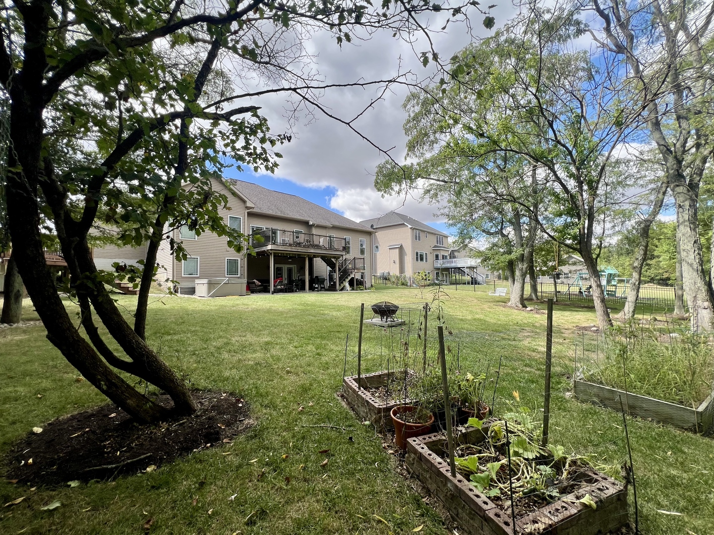 2112 Slade Lane Mahomet, IL 61853 - Photo 63 of 68 a view of a house with backyard and sitting area