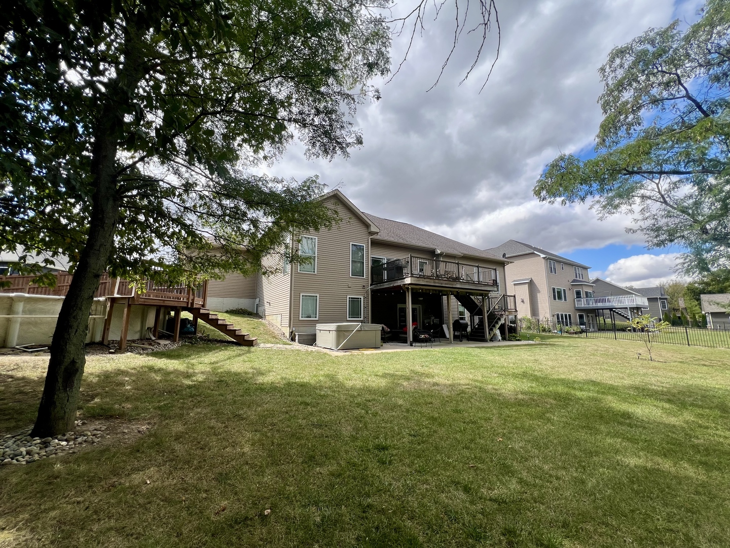 2112 Slade Lane Mahomet, IL 61853 - Photo 64 of 68 a view of a house with a big yard and large trees