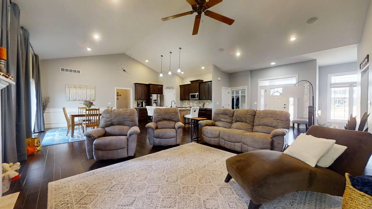 2112 Slade Lane Mahomet, IL 61853 - Photo 10 of 68 a living room with furniture kitchen view and a wooden floor