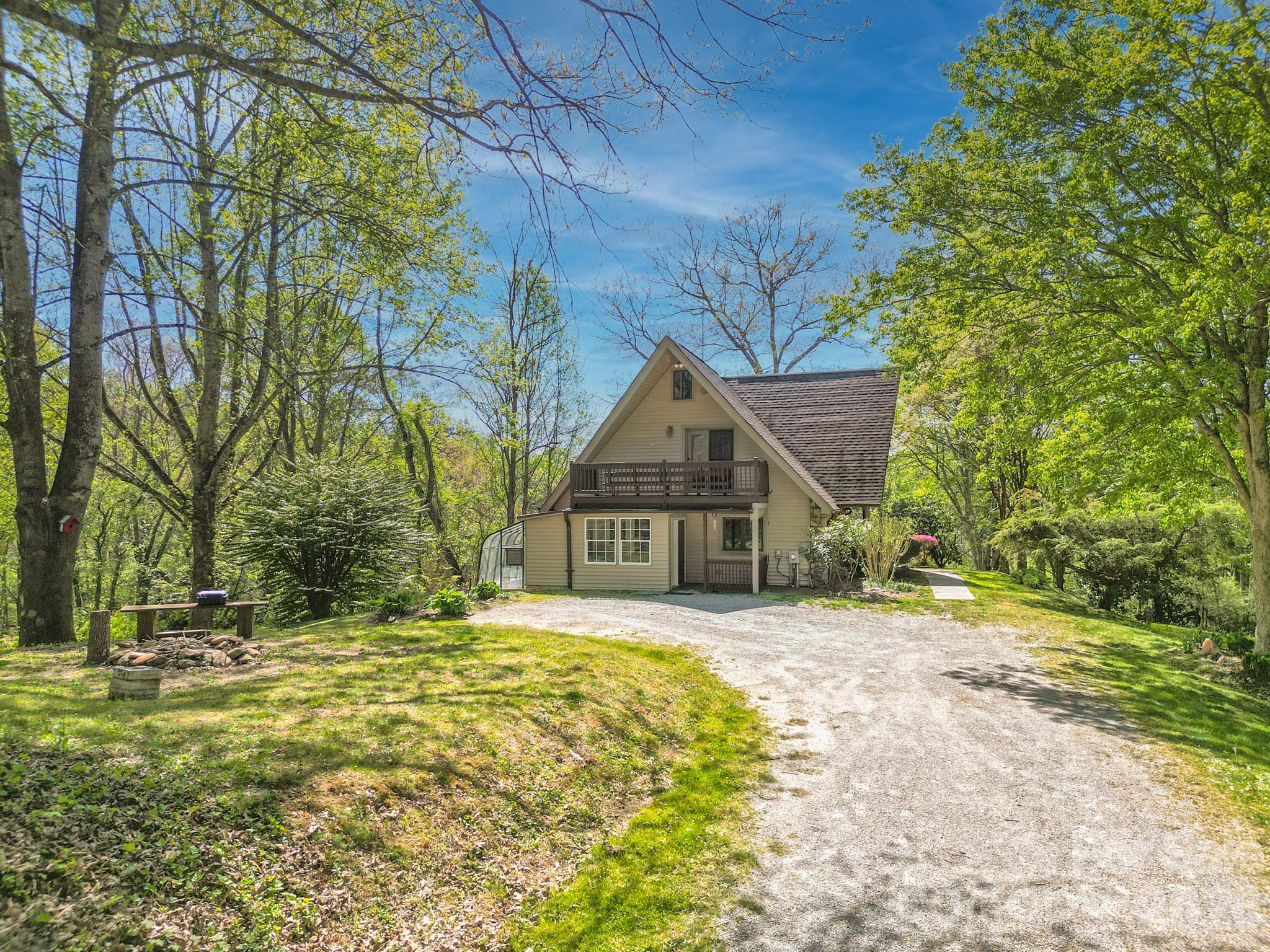 344 South Mills River Road Mills River, NC 28759 - Photo 1 of 33 a house with trees in front of it