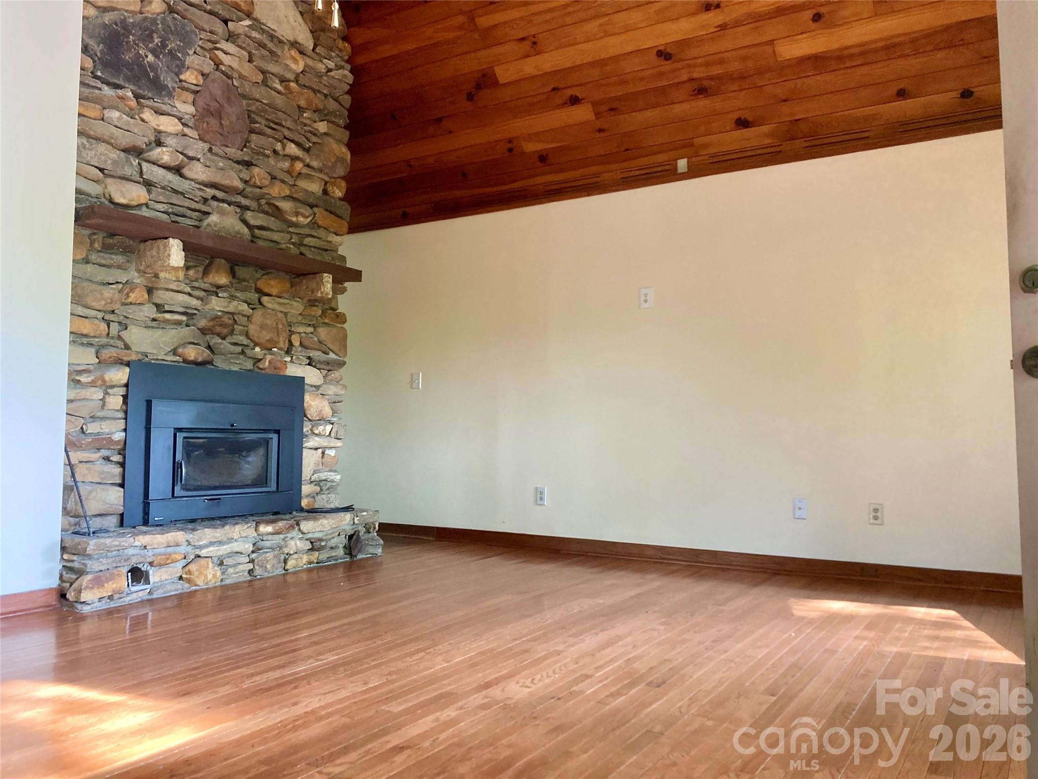344 South Mills River Road Mills River, NC 28759 - Photo 12 of 33 a view of empty room with wooden floor and fireplace