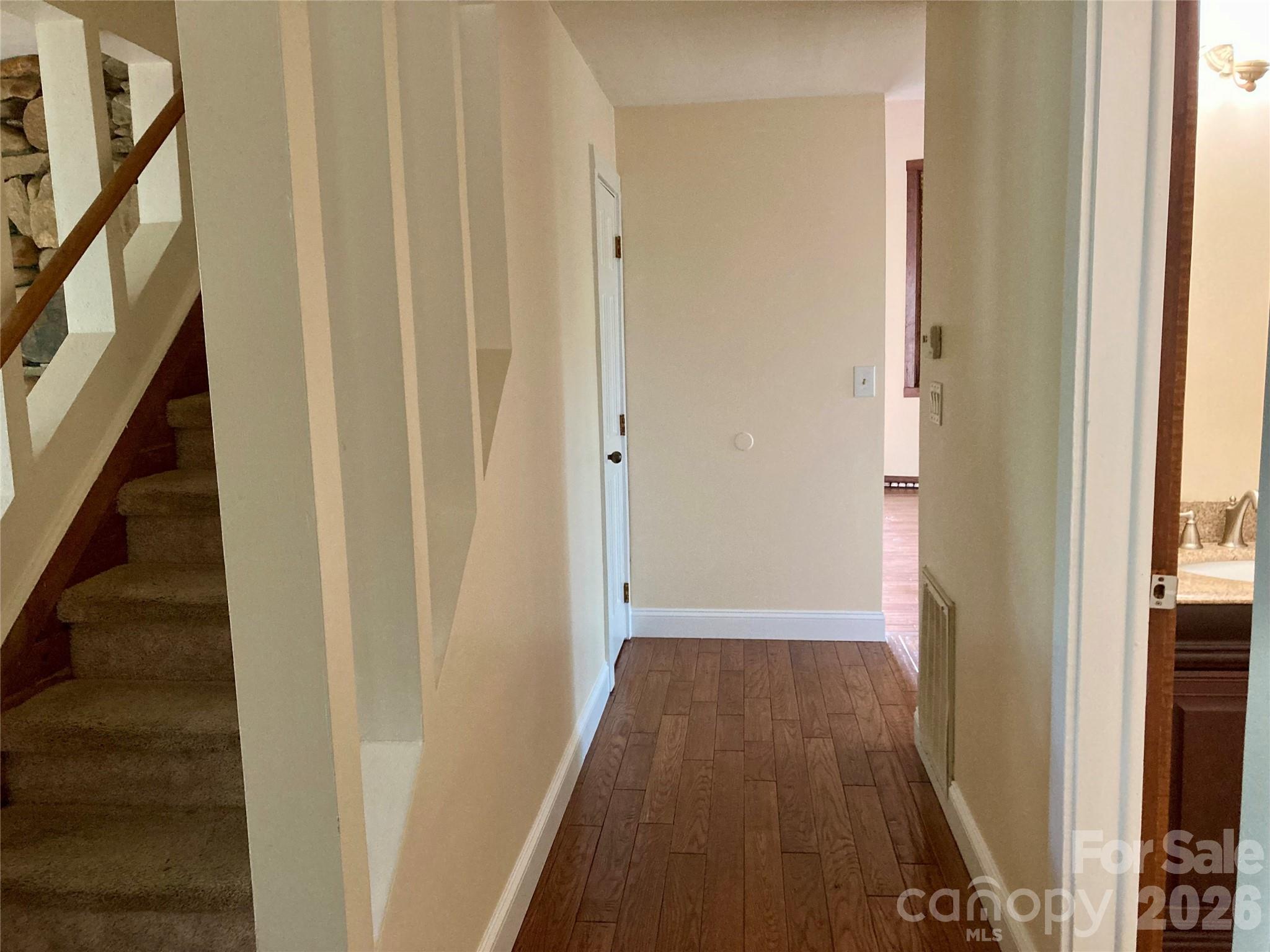 344 South Mills River Road Mills River, NC 28759 - Photo 14 of 33 a view of a hallway with wooden floor and staircase