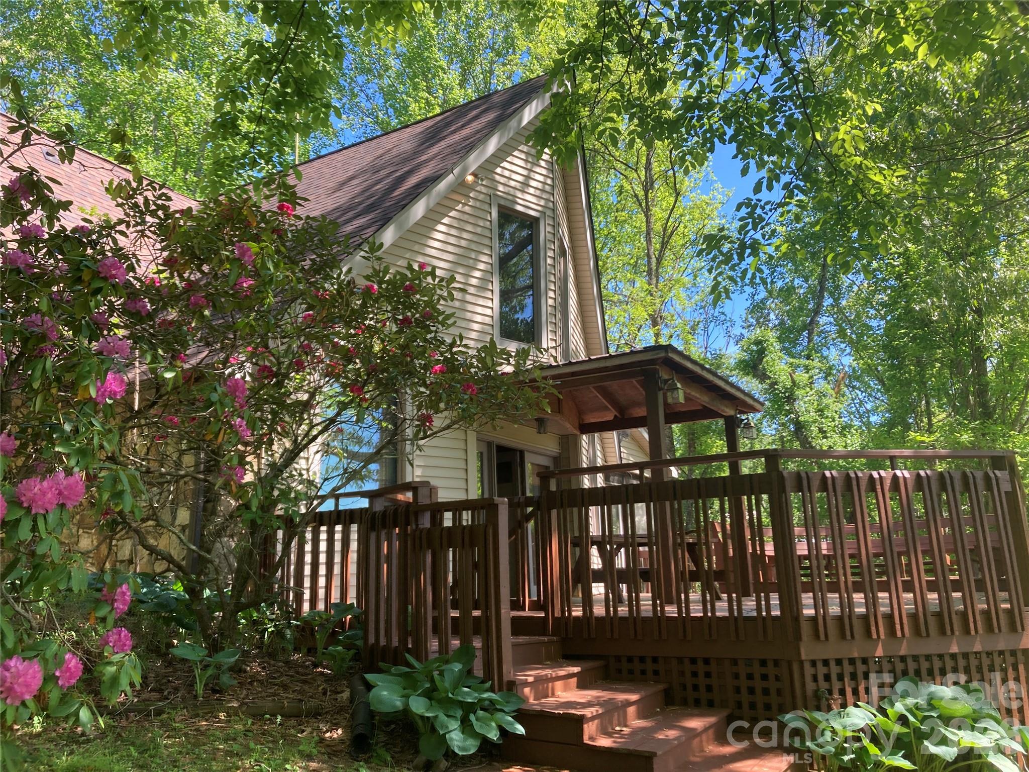 344 South Mills River Road Mills River, NC 28759 - Photo 5 of 33 a front view of a house with a garden