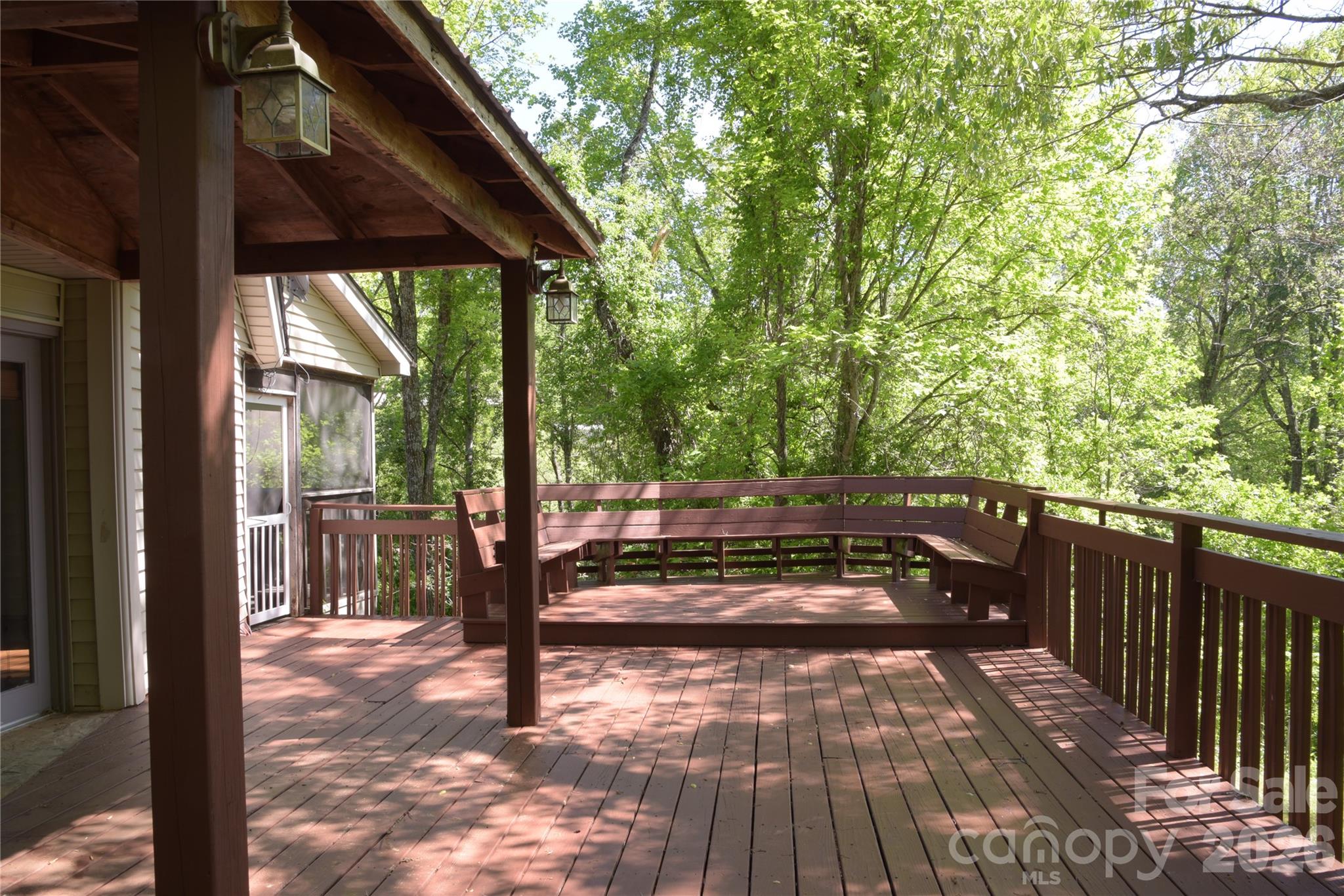 344 South Mills River Road Mills River, NC 28759 - Photo 6 of 33 a view of a patio with table and chairs with wooden floor and fence