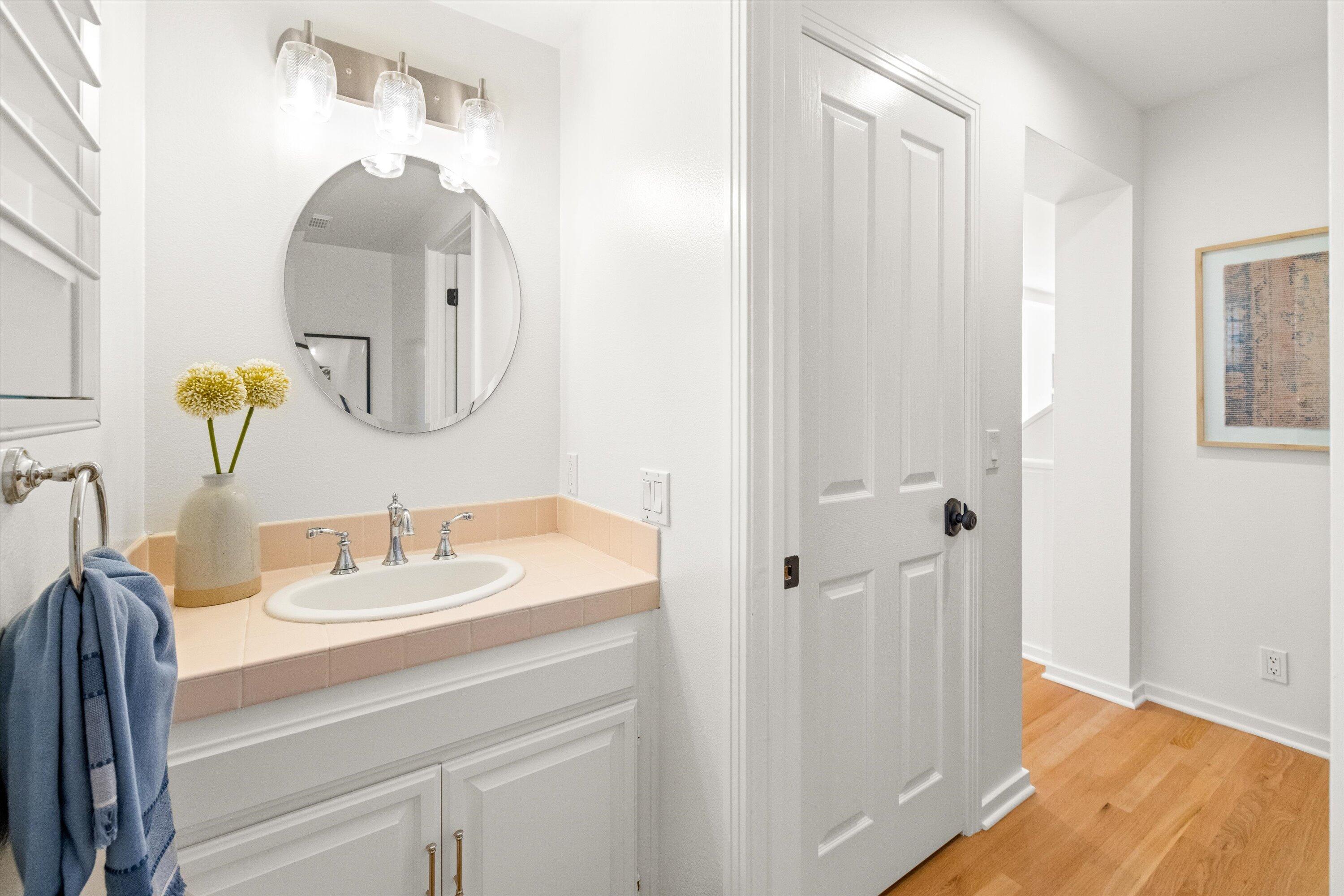 931 Weldon Road Santa Barbara, CA 93109 - Photo 14 of 32 a bathroom with a sink and a mirror