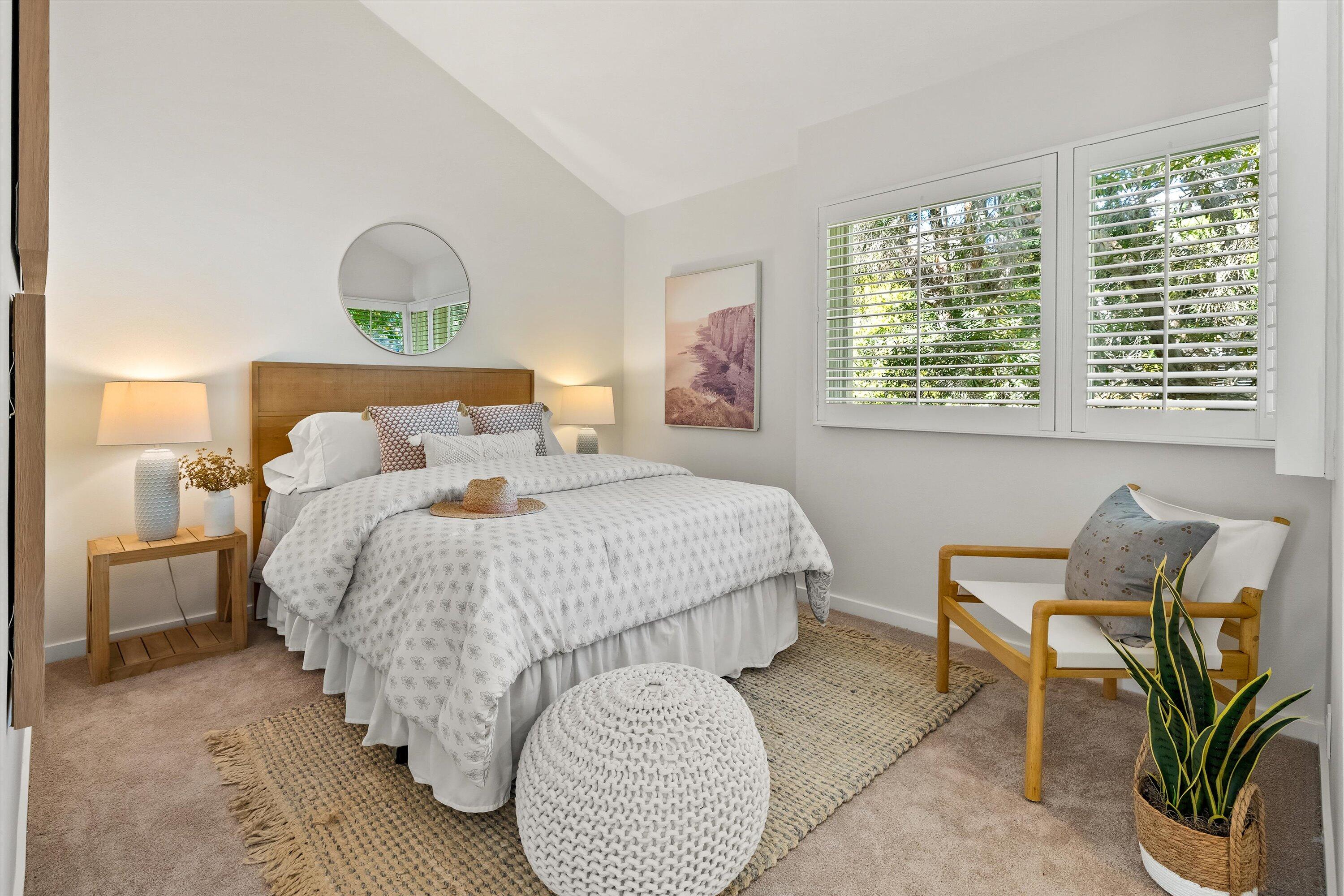 931 Weldon Road Santa Barbara, CA 93109 - Photo 16 of 32 a bedroom with a bed and a chair