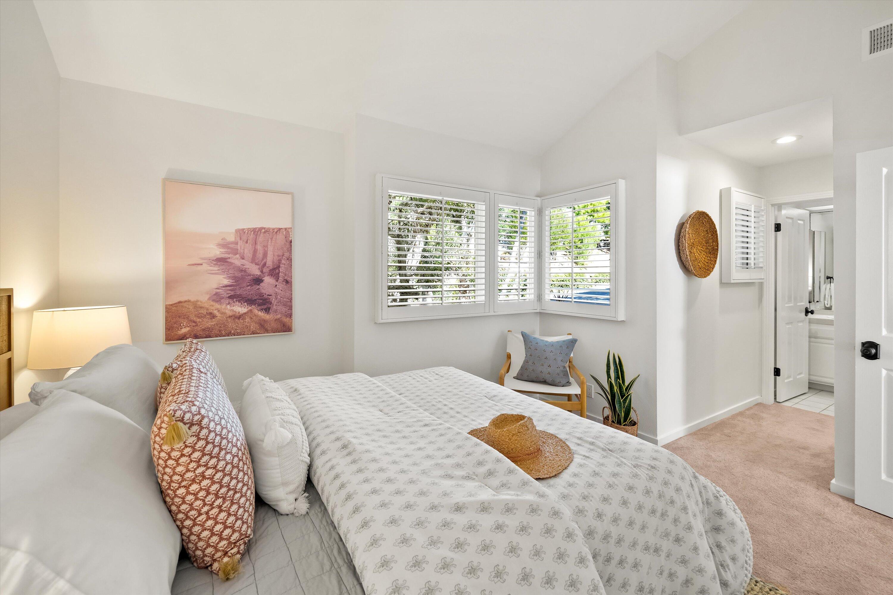 931 Weldon Road Santa Barbara, CA 93109 - Photo 17 of 32 a bedroom with a large bed and a window