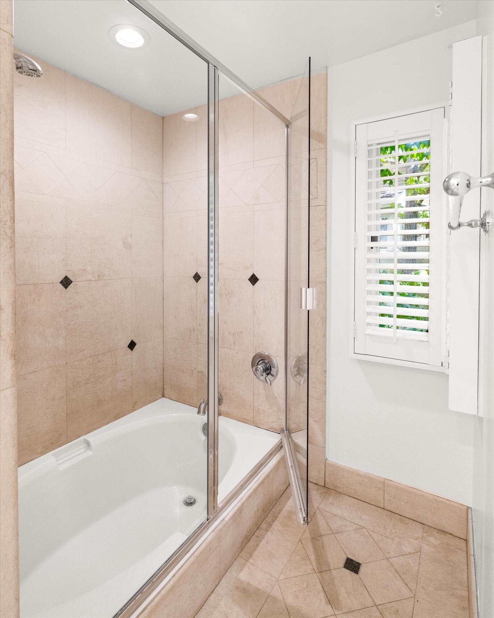 931 Weldon Road Santa Barbara, CA 93109 - Photo 25 of 32 a bathroom with a bathtub and a shower