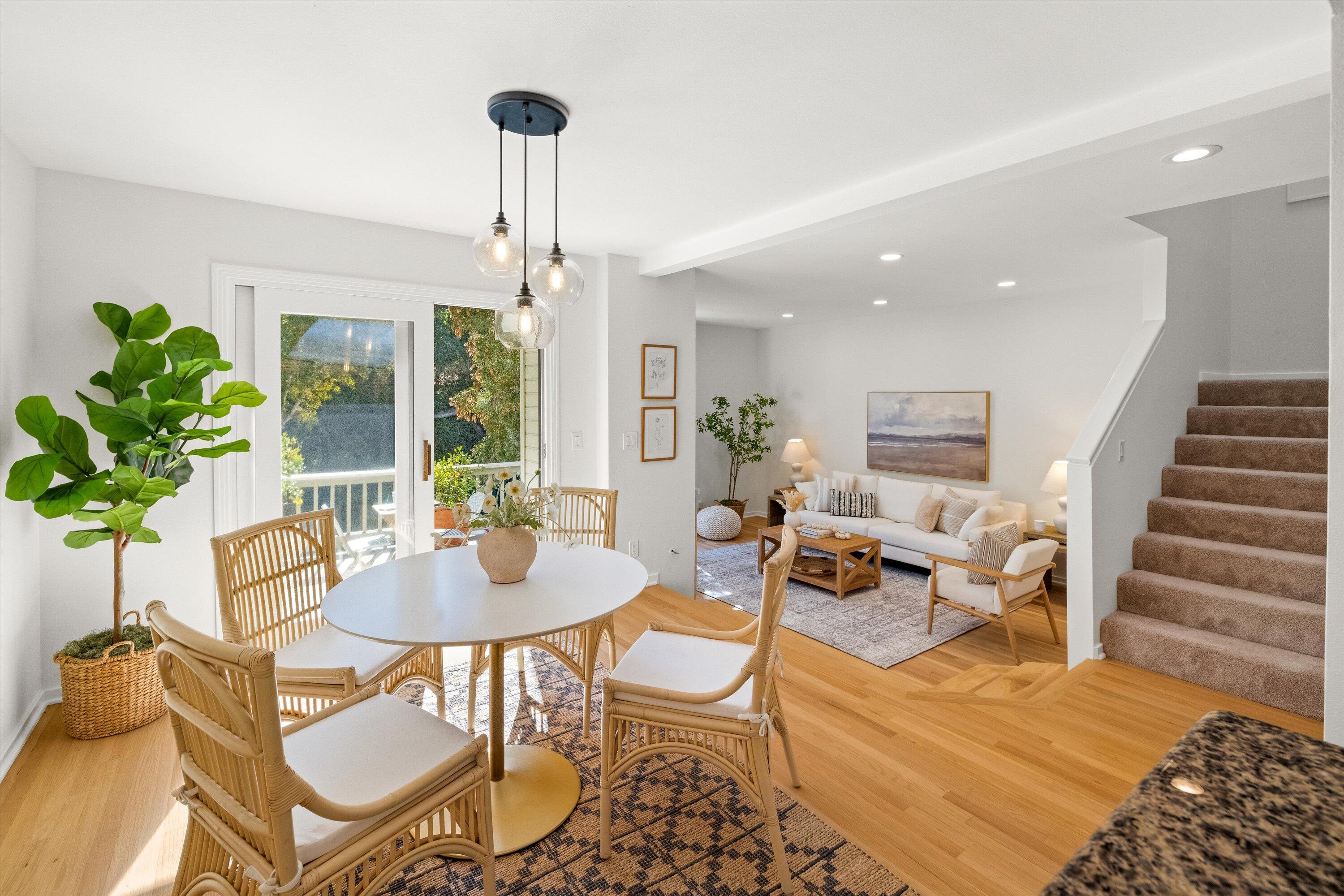 931 Weldon Road Santa Barbara, CA 93109 - Photo 9 of 32 a living room with furniture a chandelier and a dining table
