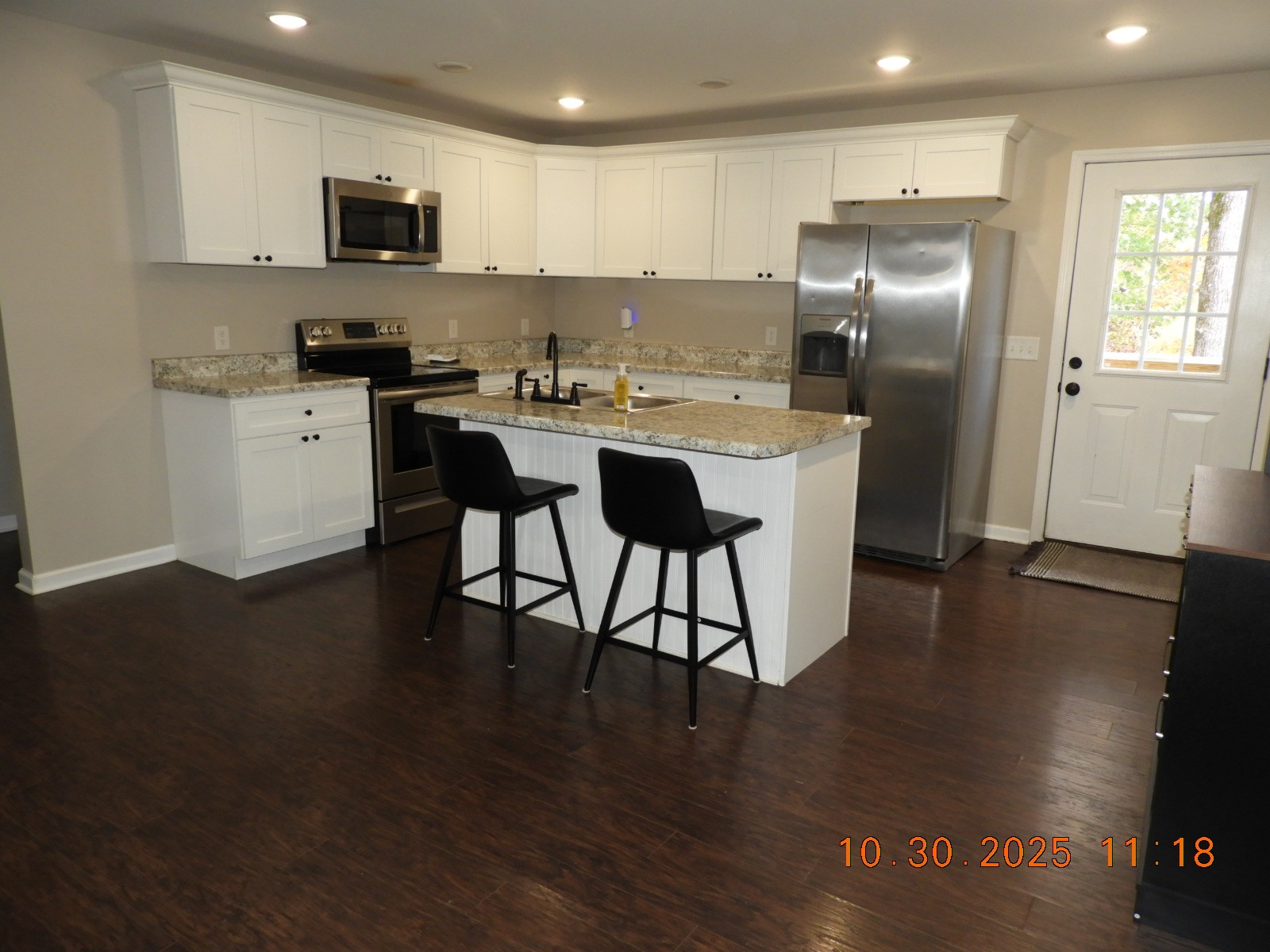 155 Poling Drive Pulaski, TN 38478 - Photo 21 of 36 a kitchen with stainless steel appliances granite countertop a stove a sink a refrigerator and a microwave