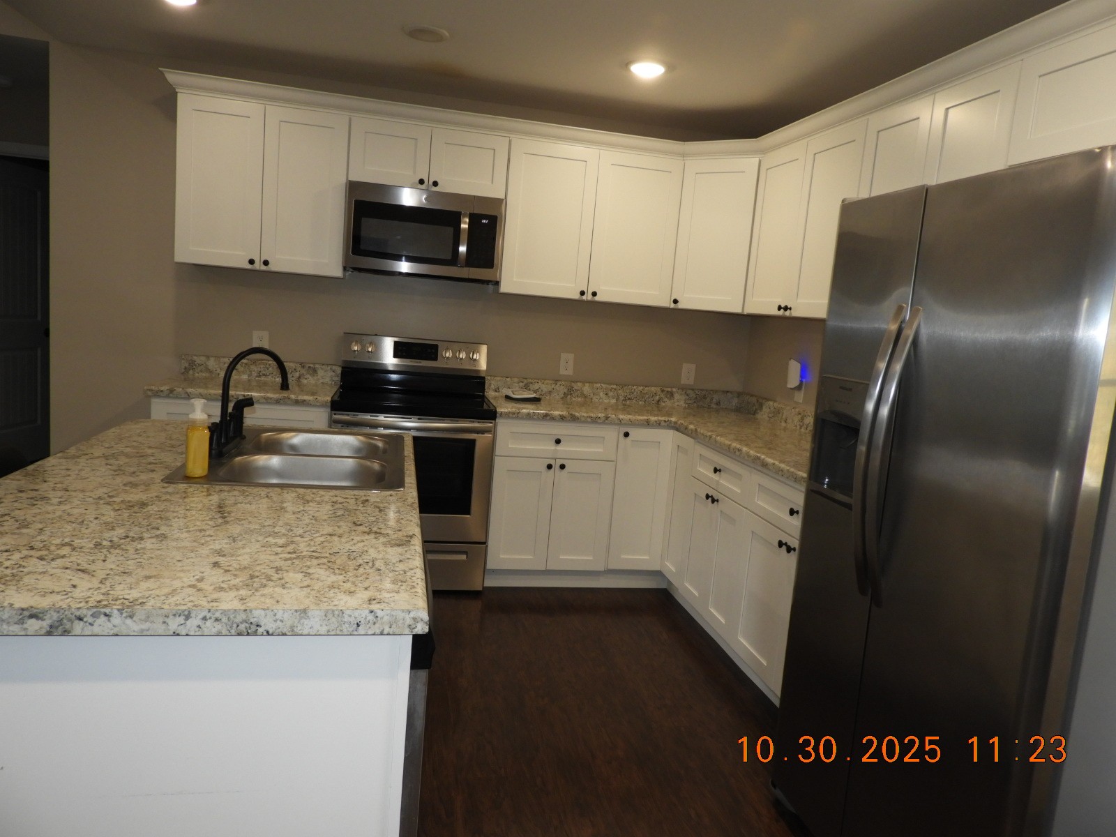155 Poling Drive Pulaski, TN 38478 - Photo 25 of 36 a kitchen with a sink a stove and refrigerator