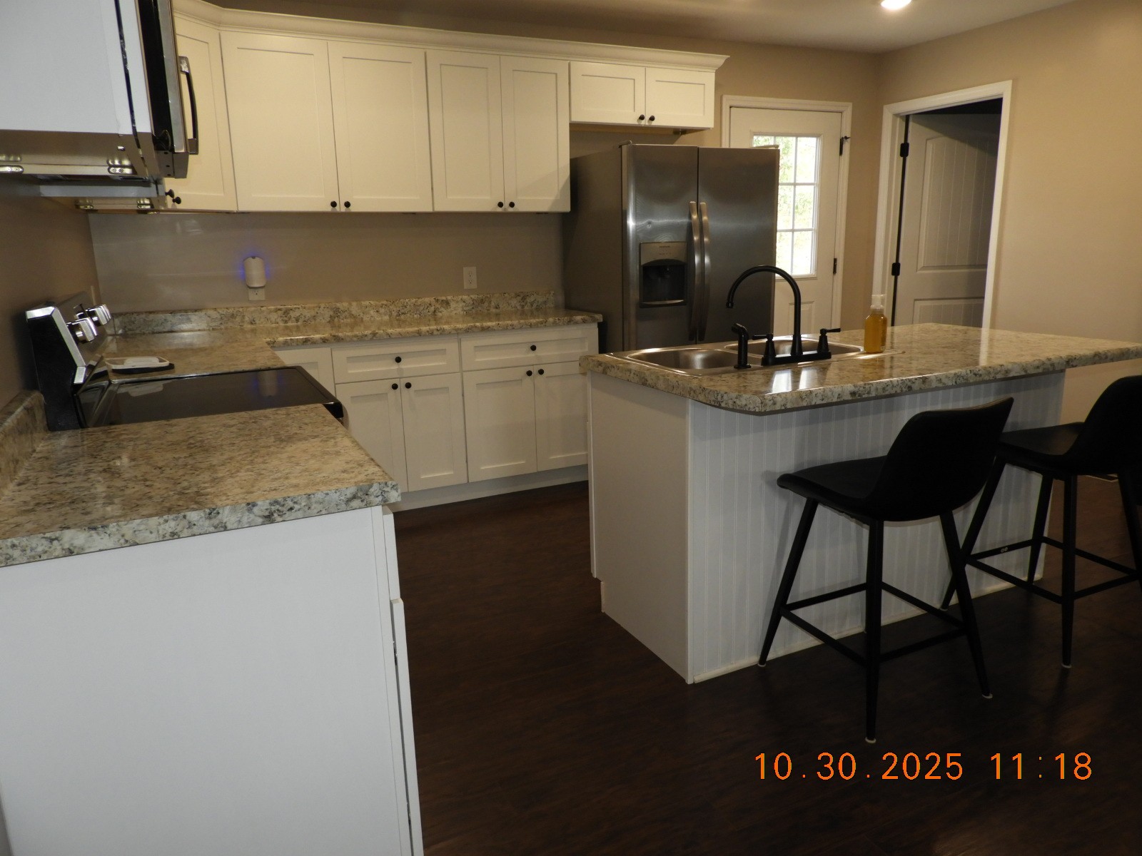 155 Poling Drive Pulaski, TN 38478 - Photo 26 of 36 a kitchen with a sink a refrigerator and cabinets