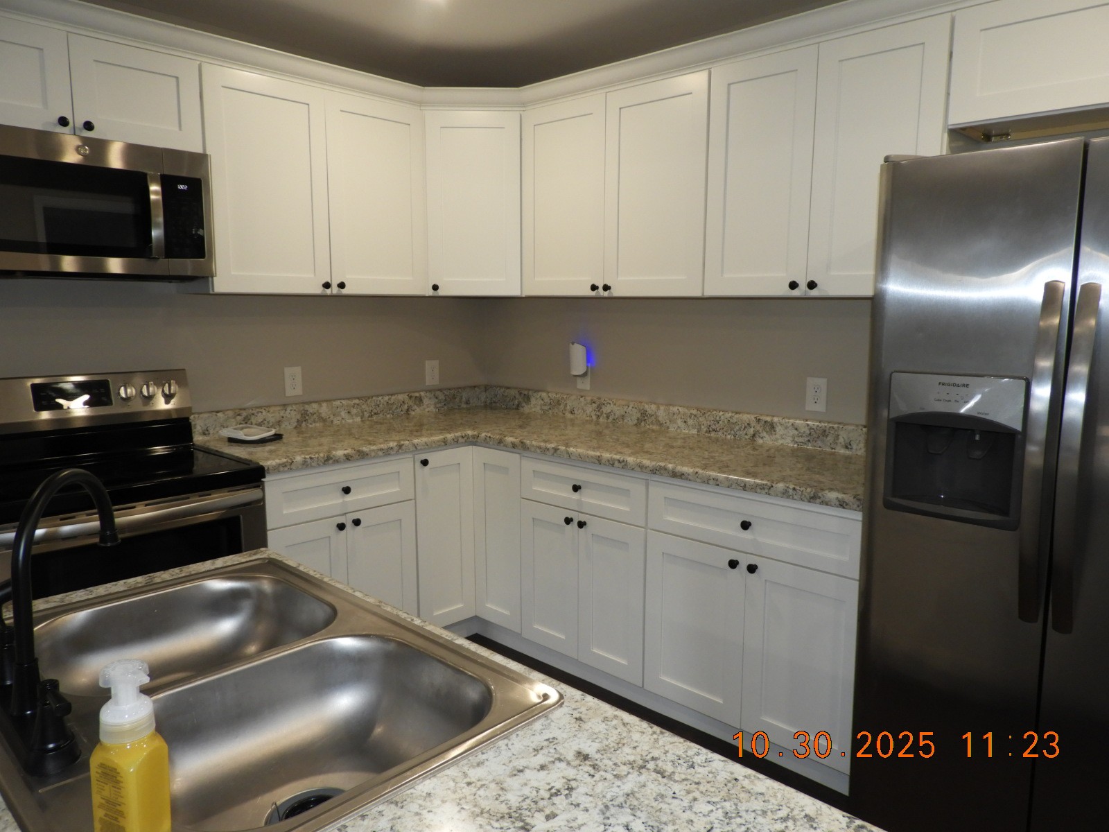 155 Poling Drive Pulaski, TN 38478 - Photo 27 of 36 a kitchen with granite countertop white cabinets and stainless steel appliances