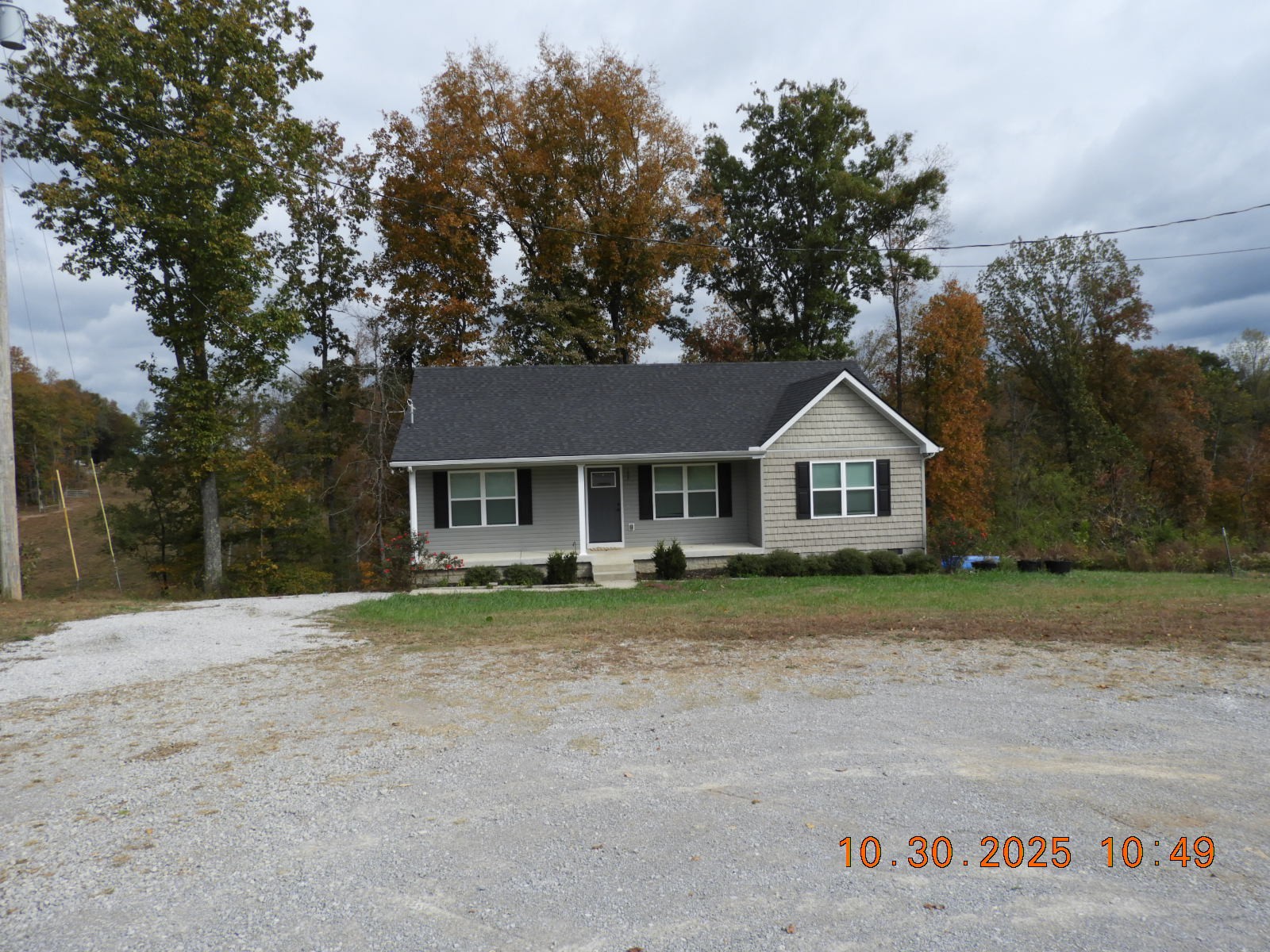 155 Poling Drive Pulaski, TN 38478 - Photo 7 of 36 a front view of a house with a yard and garage