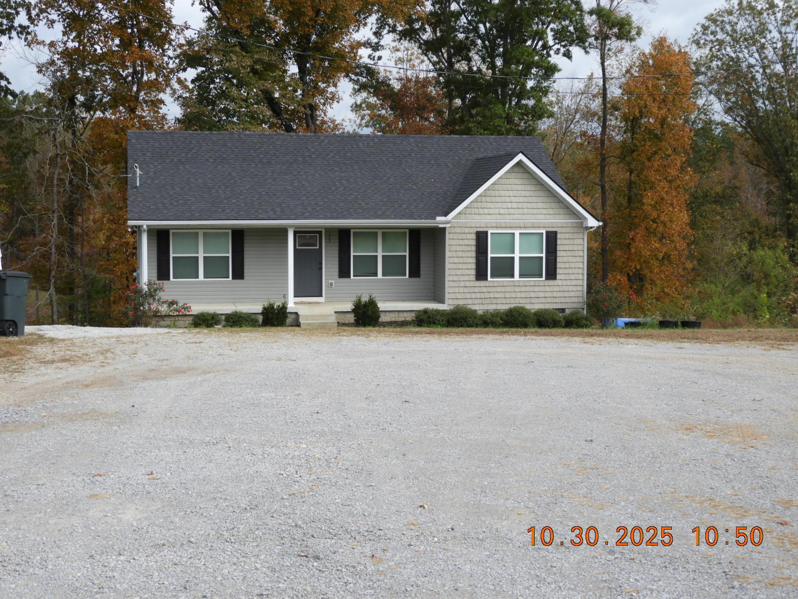 155 Poling Drive Pulaski, TN 38478 - Photo 8 of 36 a front view of house with yard and trees in the background