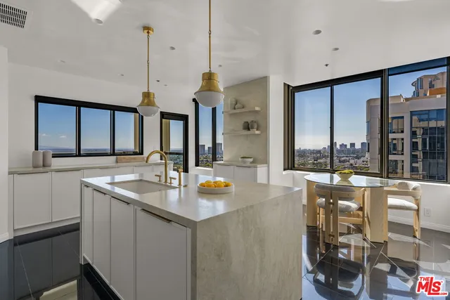 a kitchen with a sink and a large window