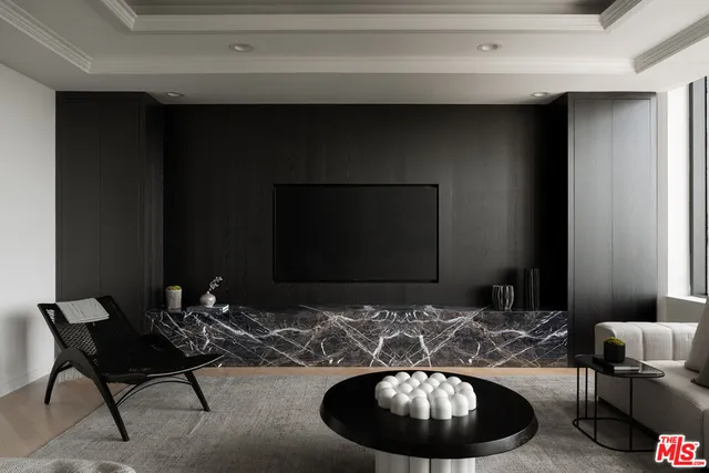 a room with a couch chair and a fireplace