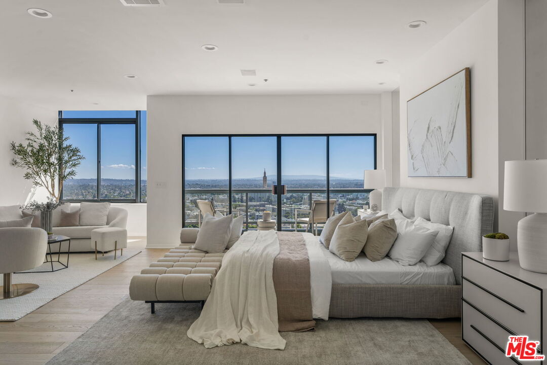 10724 Wilshire Boulevard, Unit 1501 Los Angeles, CA 90024 - Photo 19 of 38 a living room with furniture and a large window