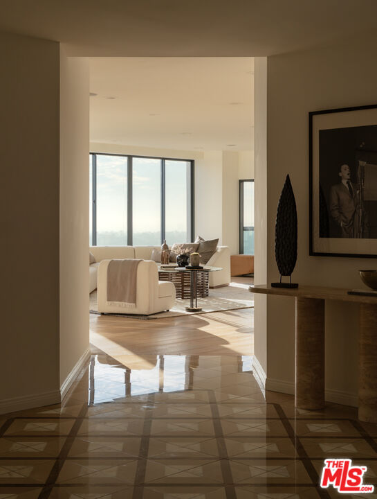 10724 Wilshire Boulevard, Unit 1501 Los Angeles, CA 90024 - Photo 3 of 38 a view of living room with furniture and floor to ceiling window