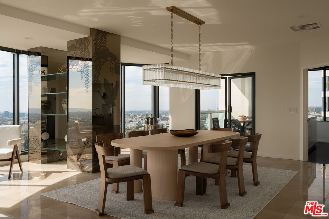 10724 Wilshire Boulevard, Unit 1501 Los Angeles, CA 90024 - Photo 7 of 38 a view of a dining room with furniture window and outside view