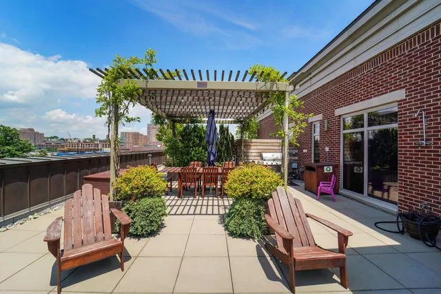 a view of a chairs and table in the patio
