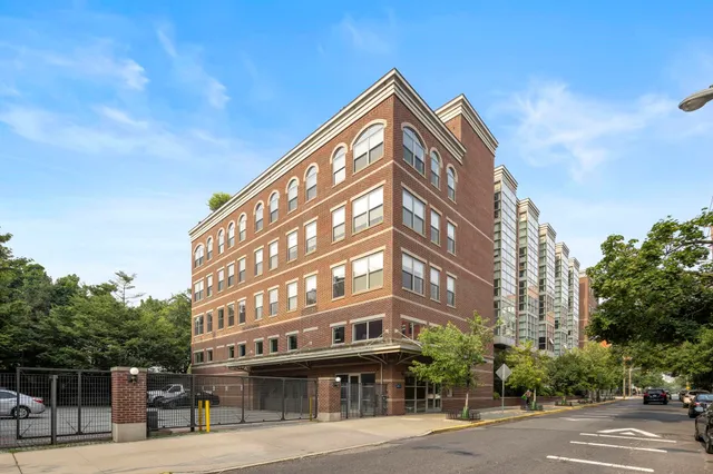 a view of a building with a street
