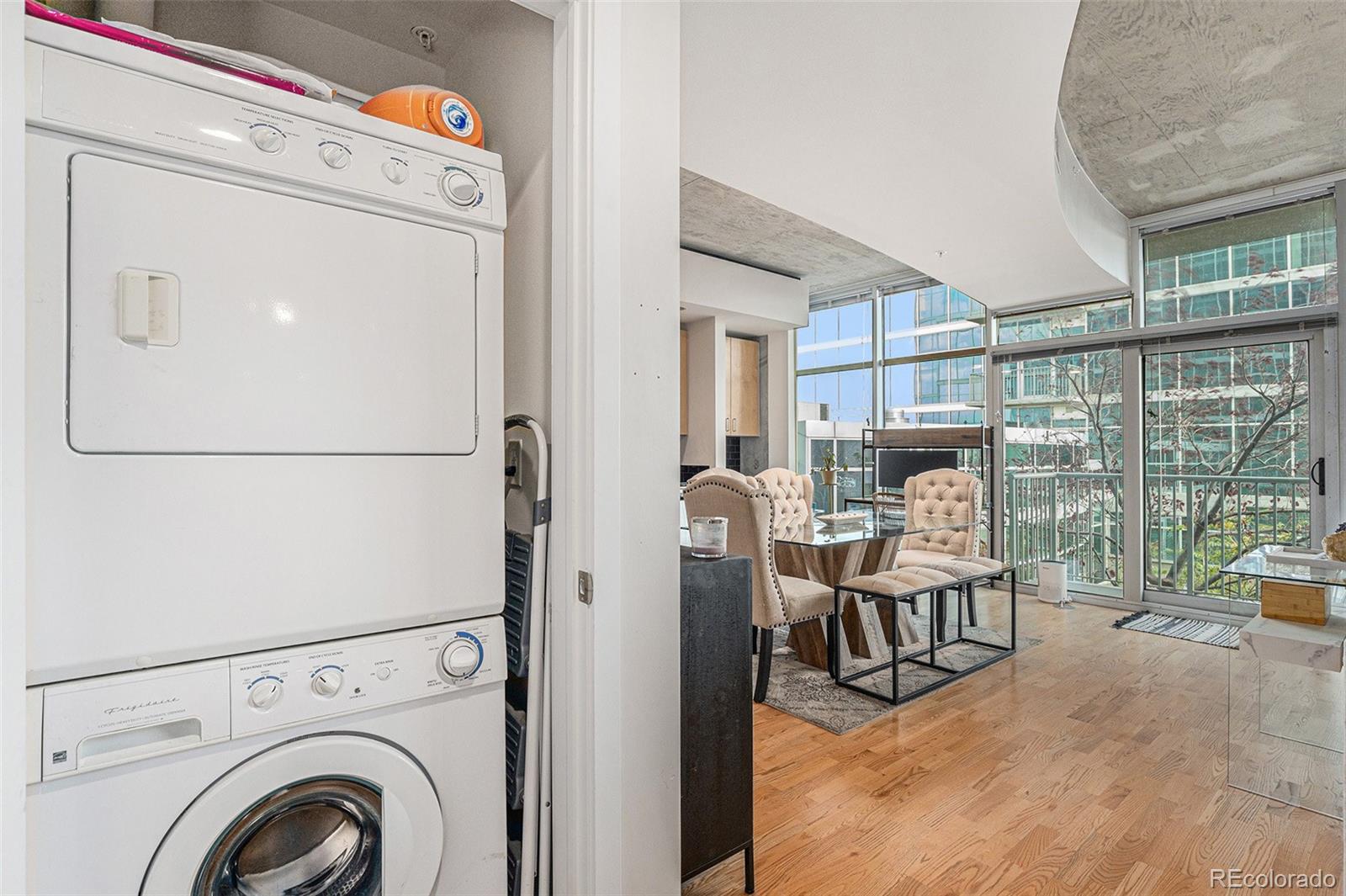 1700 Bassett Street, Unit 903 Denver, CO 80202 - Photo 19 of 31 a bed room with a bed and a table