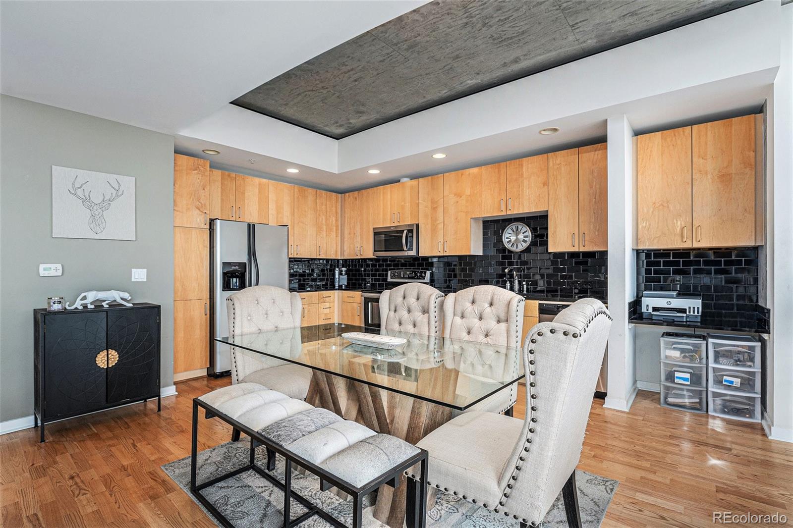 1700 Bassett Street, Unit 903 Denver, CO 80202 - Photo 2 of 31 a living room with furniture a large window and stainless steel appliances