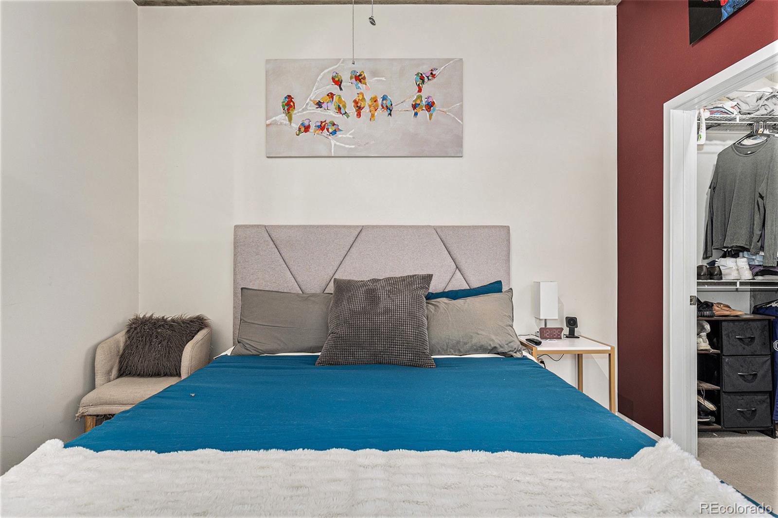 1700 Bassett Street, Unit 903 Denver, CO 80202 - Photo 21 of 31 a bedroom with a bed and a couch