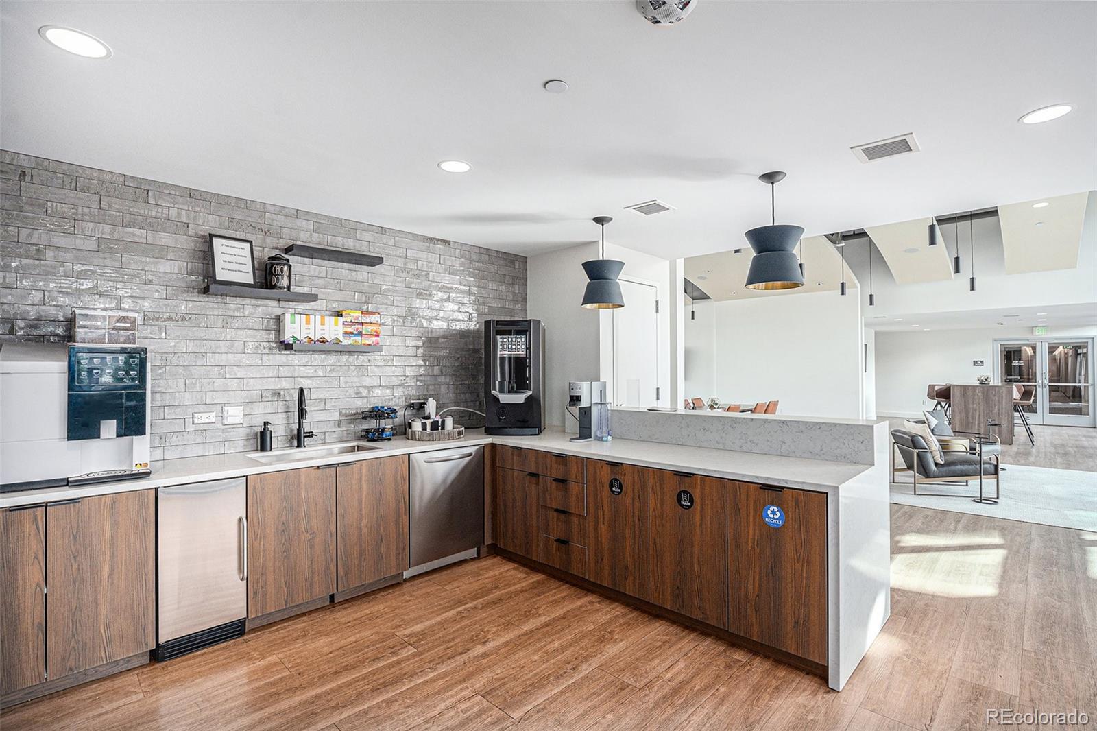 1700 Bassett Street, Unit 903 Denver, CO 80202 - Photo 27 of 31 a large kitchen with stainless steel appliances a sink and cabinets