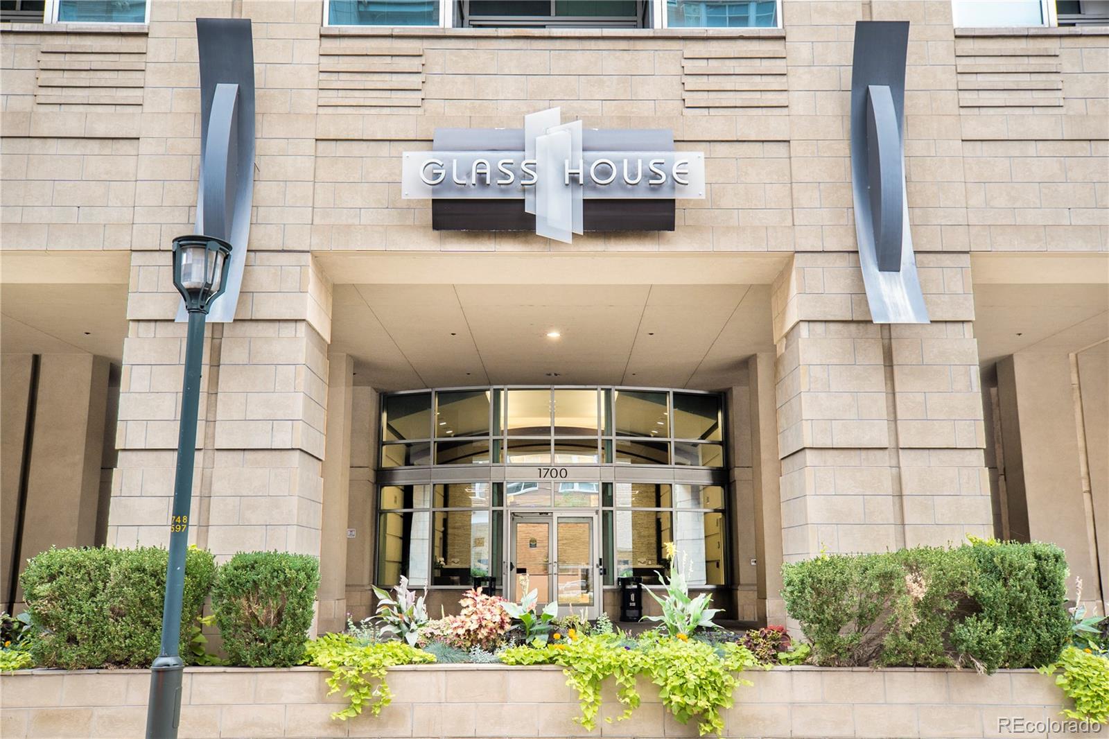 1700 Bassett Street, Unit 903 Denver, CO 80202 - Photo 3 of 31 a front view of a building with glass windows and door