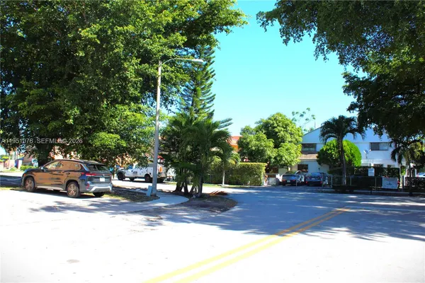 a view of street with parked cars