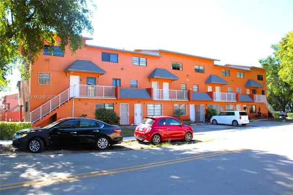 a cars parked in front of a building