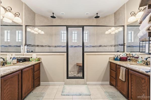 1405 Eva Street Edinburg, TX 78539 - Photo 11 of 18 a kitchen with stainless steel appliances granite countertop a refrigerator and a stove