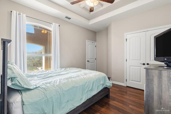 1405 Eva Street Edinburg, TX 78539 - Photo 15 of 18 a bedroom with a bed and a flat tv screen on dresser