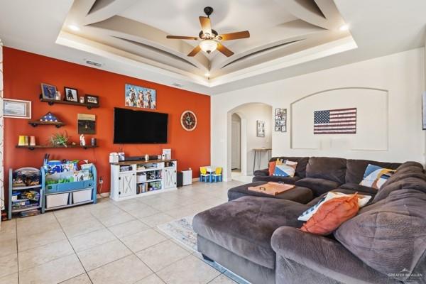 1405 Eva Street Edinburg, TX 78539 - Photo 2 of 18 a living room with furniture and a flat screen tv