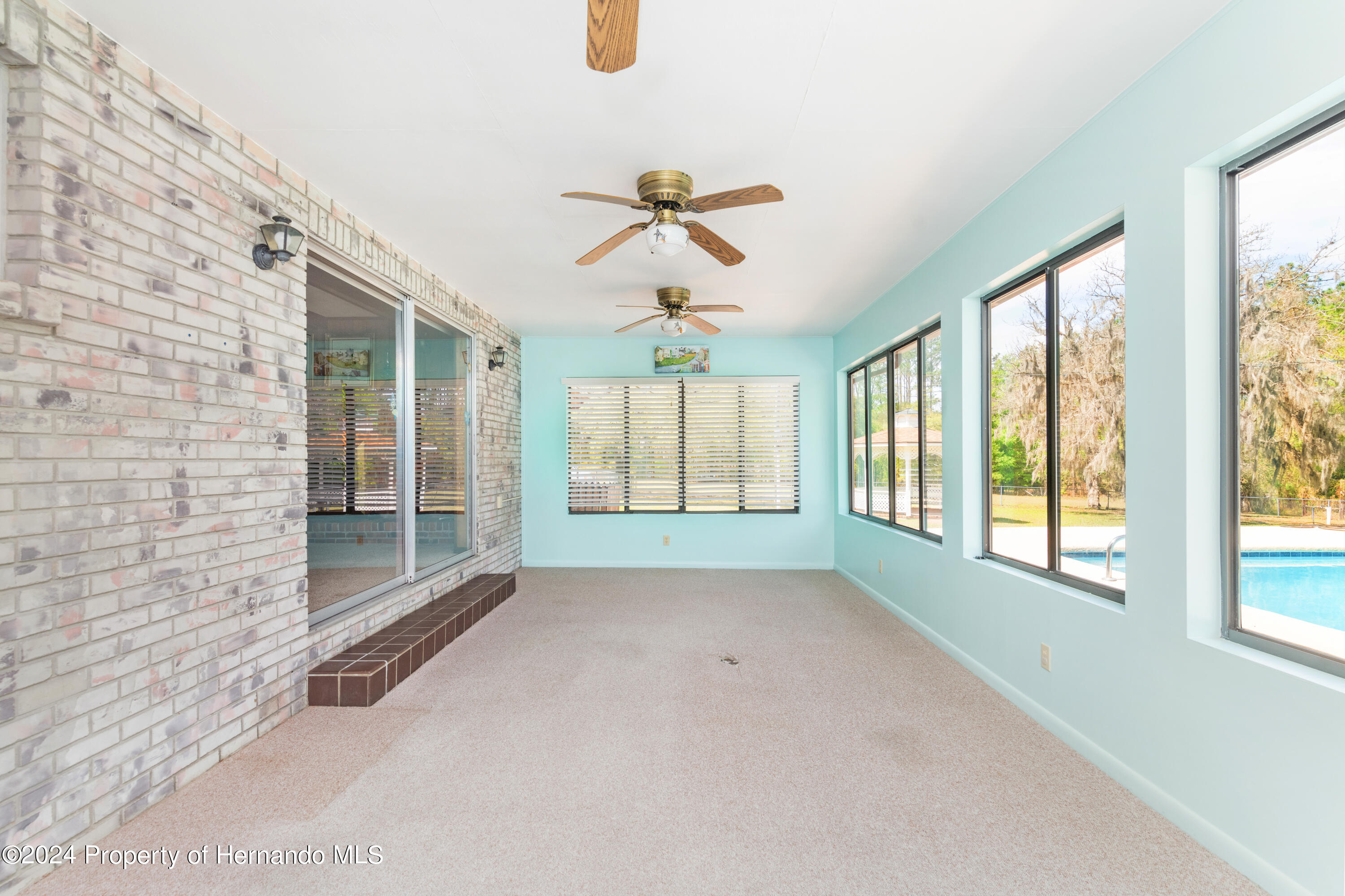 23019 Grubbs Road Brooksville, FL 34601 - Photo 42 of 45 Rear enclosed porch