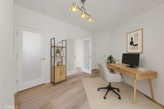 a bathroom with a granite countertop sink a mirror and a shower