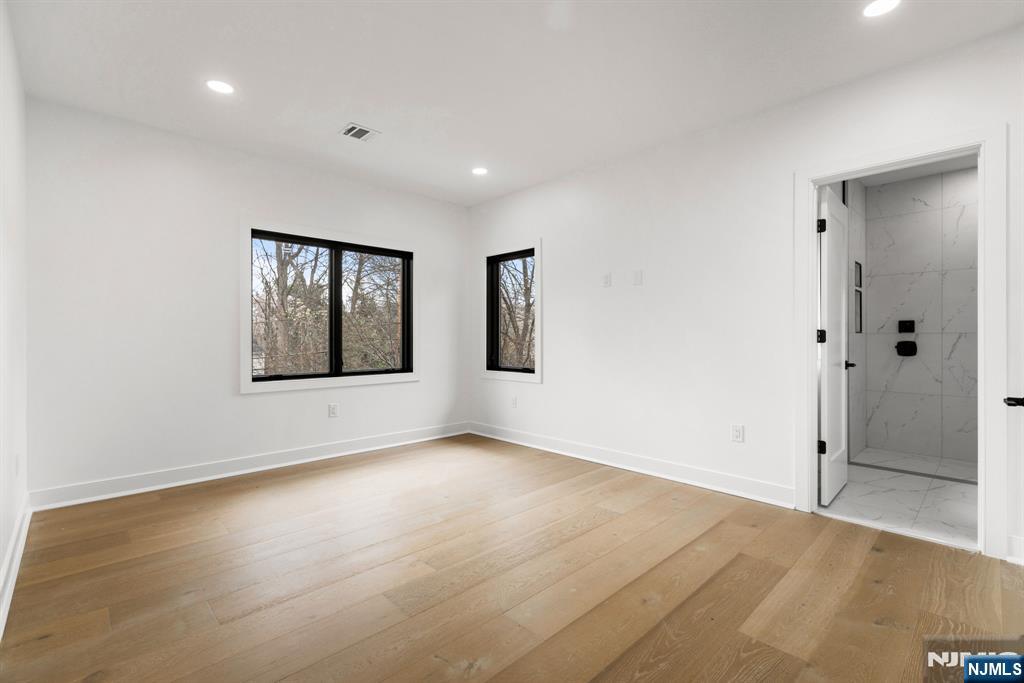 45 Riverview Terrace Mahwah, NJ 07430 - Photo 20 of 25 a view of an empty room with closet and wooden floor