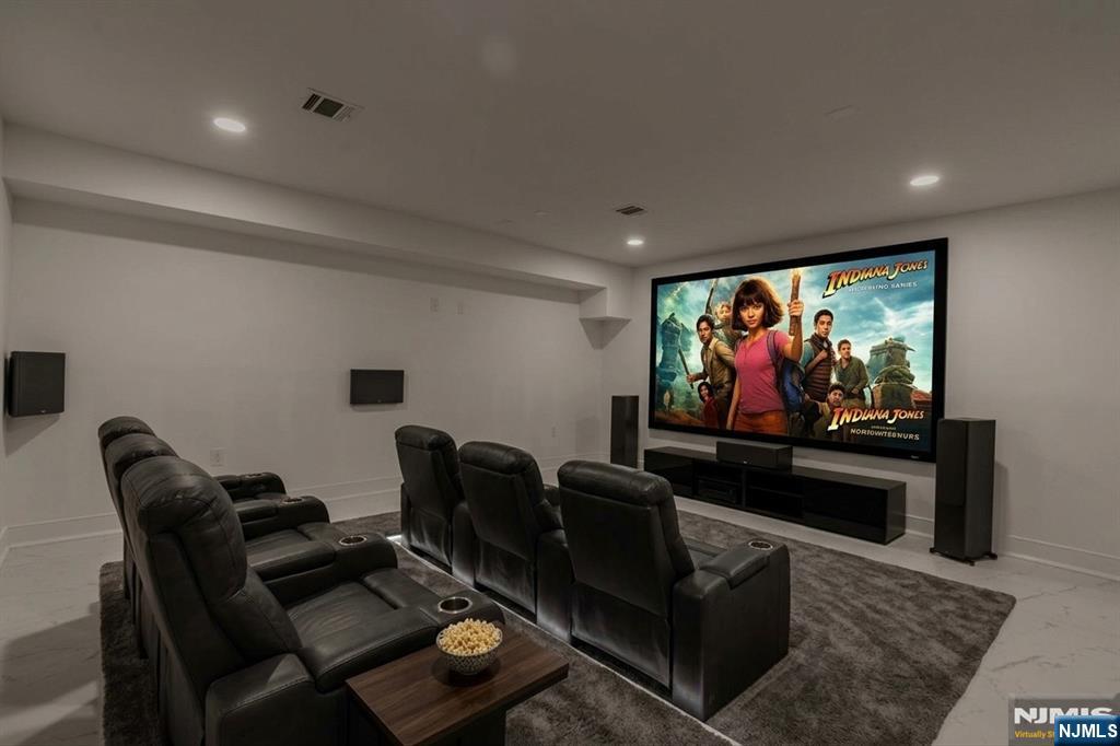 45 Riverview Terrace Mahwah, NJ 07430 - Photo 23 of 25 a living room with furniture and a flat screen tv