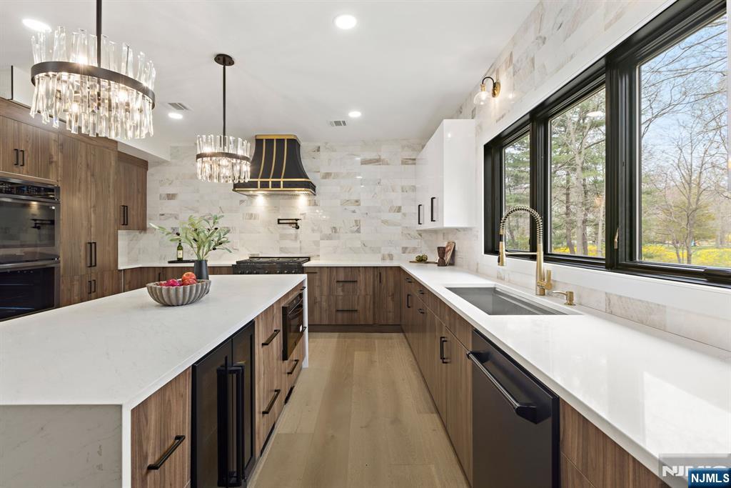 45 Riverview Terrace Mahwah, NJ 07430 - Photo 5 of 25 a kitchen with stainless steel appliances a sink stove and cabinets
