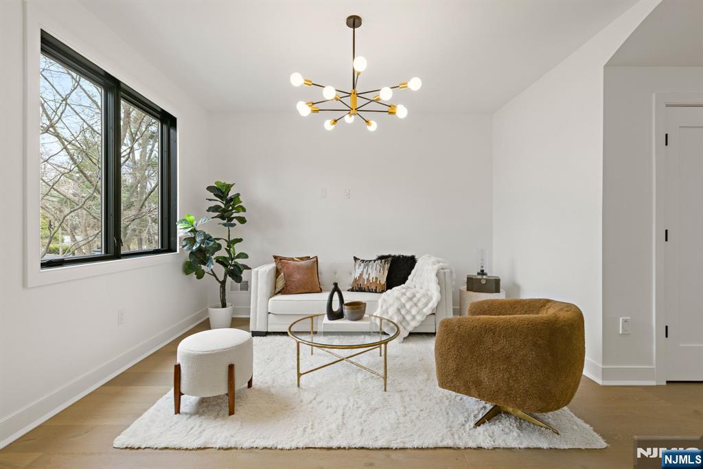 45 Riverview Terrace Mahwah, NJ 07430 - Photo 6 of 25 a living room with furniture a window and a potted plant