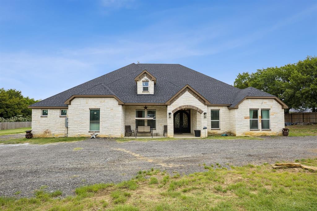6467 Asher Road Alvarado, TX 76009 - Photo 12 of 40 a front view of a house with a yard