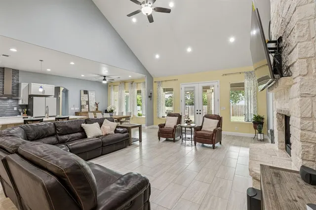 a living room with furniture and a fireplace