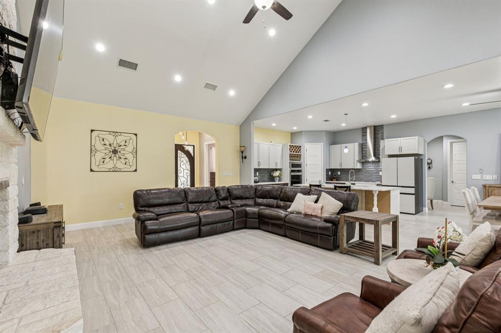 6467 Asher Road Alvarado, TX 76009 - Photo 21 of 40 a living room with furniture or couch and a flat screen tv