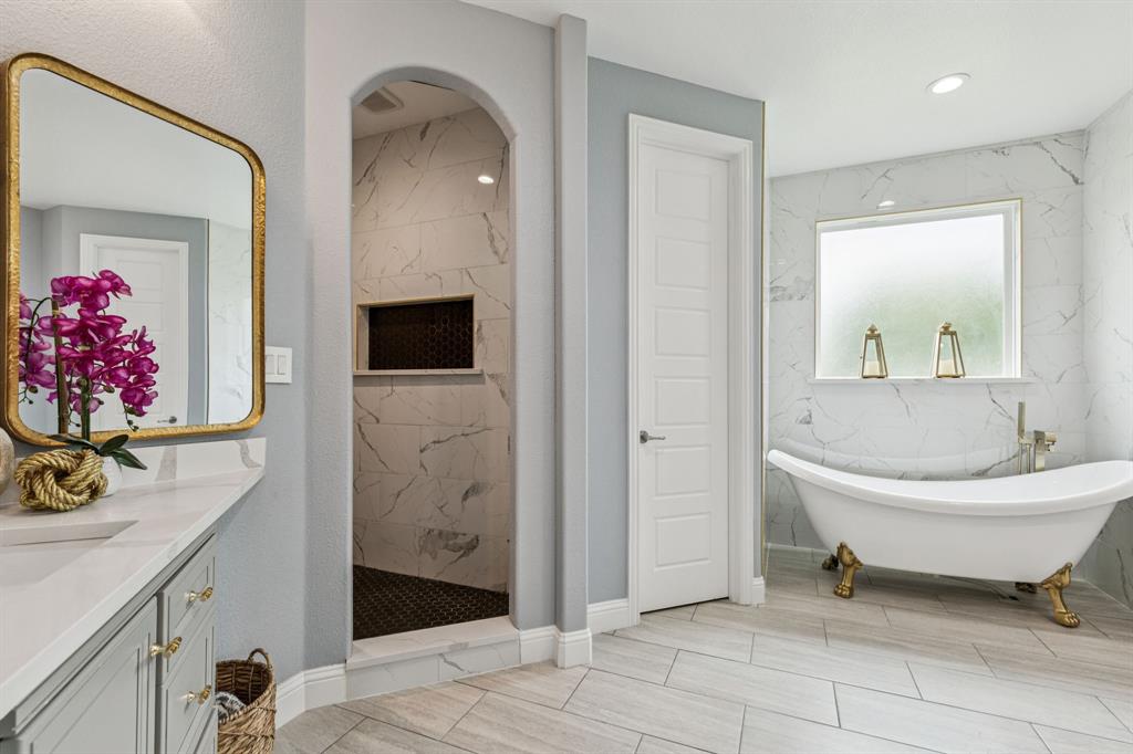 6467 Asher Road Alvarado, TX 76009 - Photo 26 of 40 a spacious bathroom with a toilet a sink and mirror
