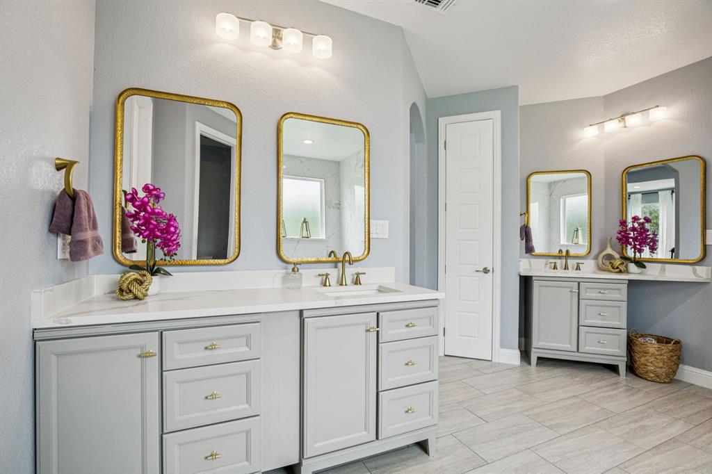 6467 Asher Road Alvarado, TX 76009 - Photo 27 of 40 a bathroom with a double vanity sink and a mirror