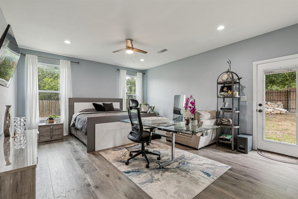 6467 Asher Road Alvarado, TX 76009 - Photo 29 of 40 a bedroom with a bed gym equipment and a large window